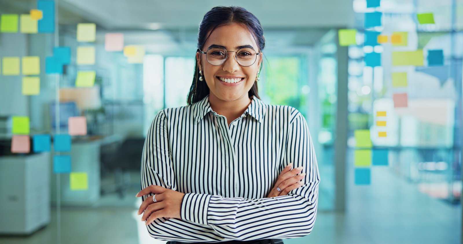 woman-smile-and-glass-wall-with-arms-crossed-by-n-2026-03-25-05-38-08-utc-scaled 